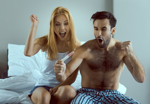 Happy young couple expecting to be parents in nine months