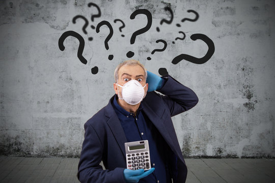 Adult Business Man With Calculator And Face Mask Question Marks Isolated On Background