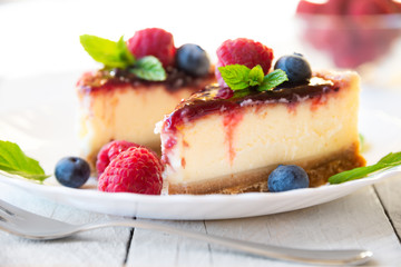 Homemade delicious cheesecake with fresh fruit and mint