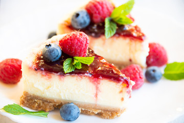 Homemade delicious cheesecake with fresh fruit and mint