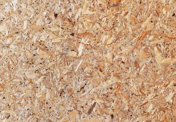 Texture of pressed wood chips. Floor and wall paneling. Oriented strand board