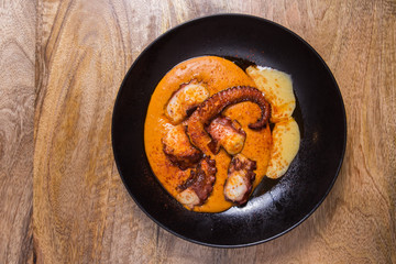 Grilled octopus with sauce.