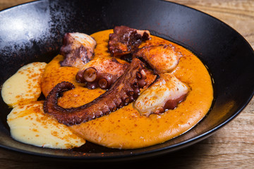 Grilled octopus with sauce.