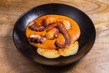 Grilled octopus with sauce.