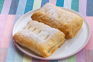 Delicious crispy bun with a plate on plate