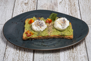 Toast with avocado and egg.