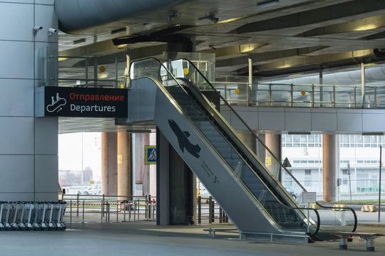 Side view of empty escalator in Pulkovo International Airport - building exterior