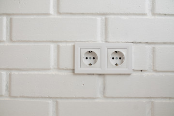 electrical outlet located on a white wall