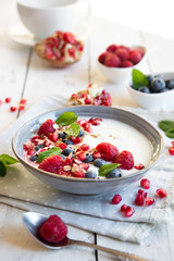 Yogurt with fresh fruit and cereals in a bowl, healthy breakfast
