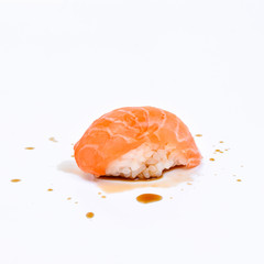 Sushi on white background and soy sauce, Sushi rolls japanese food isolated on white background. California Sushi roll with tuna, vegetables and unagi sauce closeup. Japan restaurant menu.