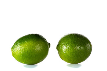 clean washed lime with drops of water on a black or white background isolated