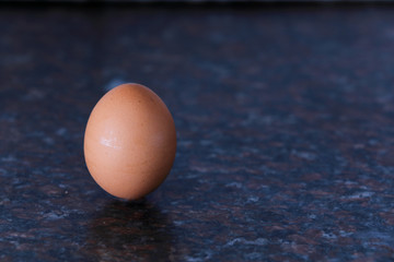 A fresh egg on a table top