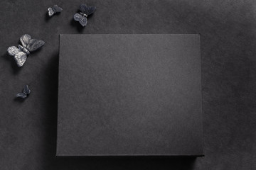 Black carton box on dark background