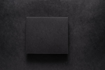 Black carton box on dark background, mock up