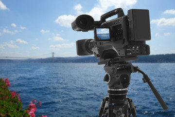 Recording beautiful view of seascape on professional video camera