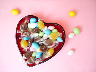 heart shaped glass bowl with candies