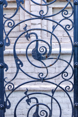 Fragment of a metal grill with a bird