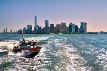 Fotobehang Kust Manhattan cityscape with ocean views and coast guard in the foreground  © Paweł Kowalczuk