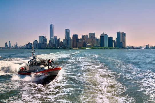Manhattan cityscape with ocean views and coast guard in the foreground