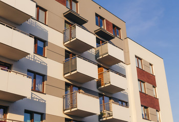 The facade of a residential building bathed in sunlight