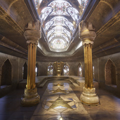 A hyper-realistic fantasy 3D interior of a temple. Majestic pillars, arches, vitreous  and dreamy atmosphere follows this image.  Luxurious golden details and cinematic view.   © HWWO Stock
