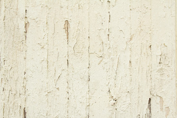Old beige rustic wooden boards with cracked and peeling paint texture background.