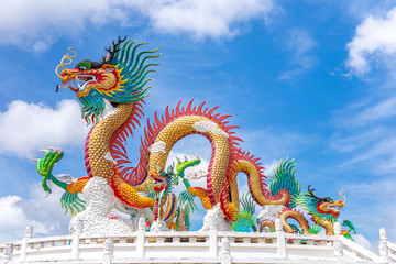 Fototapeta premium Beautiful giant or big colorful dragon statue with blue sky at Public park of Nakornsawan Park, Thailand.
