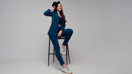 stylish business woman in a dark blue pantsuit.