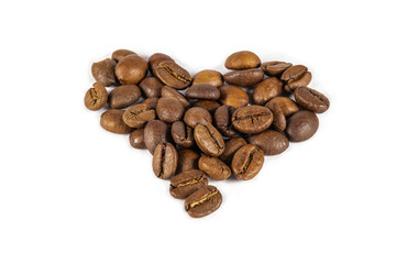 Heart shaped roasted coffee beans on a white background.