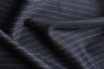 Fototapeta na wymiar Texture of dark striped fabric as background, closeup