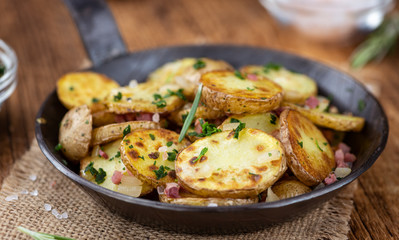Fried Potatoes on a wooden table (selective focus)
