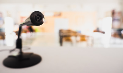 Small black mile head With long stems sticking out Put on the white table The back was a meeting room with copy space concept communication equipment.