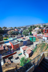 Valparaiso, Chile - March 08, 2020: Daily Life View to the Multi Colored Buildings with Bright Painting on the Streets
