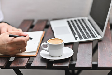 modern man works at home on the balcony. Self-isolation work from home. Beautiful european balcony