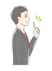 笑顔で指をさす男性の横顔