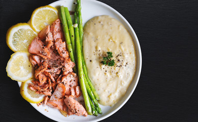 Salmon fried with olive oil, pepper and salted, Side dishes Mashed potatoes with Asparagus and lemon