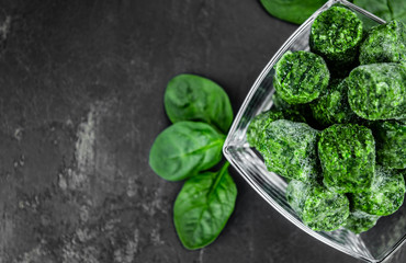 Portion of frozen spinach (close up; selective focus)