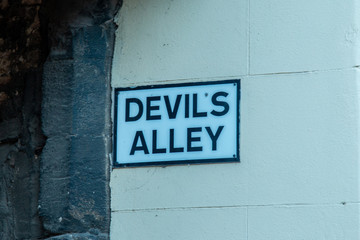 Devil's Alley sign on wall