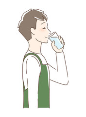 コップの水を飲む男性の横顔