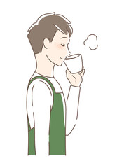 マグカップのコーヒーを飲む男性の横顔