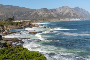 Fototapeta na wymiar Hermanus, Western Cape, South Africa. 2019. Coastal landscape from a cliff top in Hermanus a holiday resort on the garden route in the Western Cape region of S Africa.