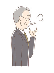 マグカップのコーヒーを飲む男性の横顔