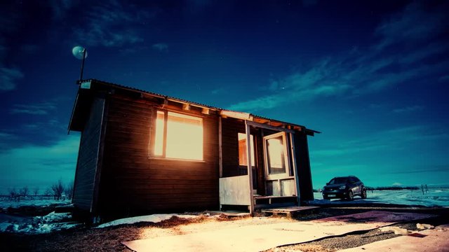 Clouds pass over cabin at night in an icy landscape. A car sits in the background. Location: Iceland.

Tripod. Fixed Focus. Wide Field of View. 23.976 FPS.