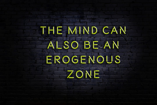 Smart and motivational quotation. Neon sign on brick wall