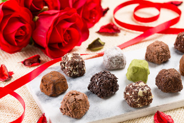 Variety chocolate truffles and rose