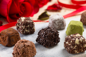 Variety chocolate truffles and rose
