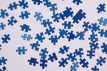 Close up of isolated blue puzzle pieces, white background