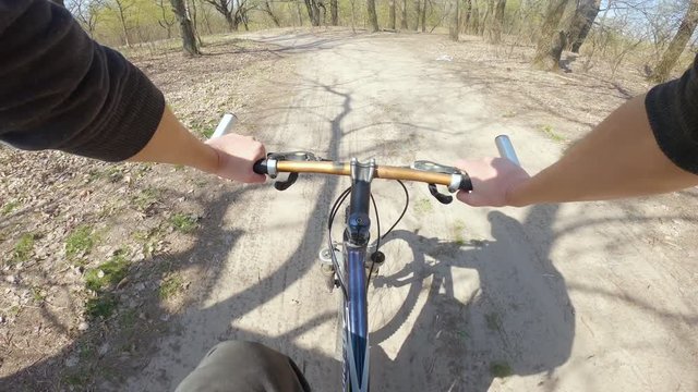 Speed riding mountain bike. View from first person perspective POV.
