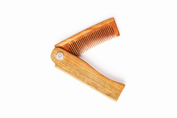 Wooden comb made of natural sandalwood for men on a white background.