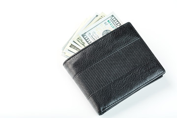 Black wallet with genuine leather dollars on an isolated white background.